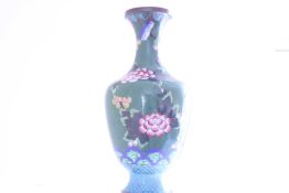 A Chinese cloisonné baluster vase, with flared rim, decorated with stylised blossoms and foliate