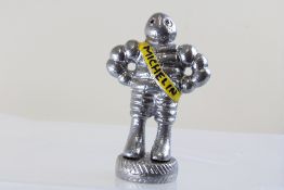 Small chrome Michelin man figure