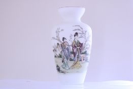 A Chinese porcelain baluster vase, the white ground enamelled with elegant ladies in a garden