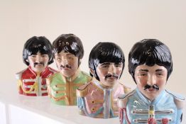 Set of 4 limited edition Beatle head toby jugs