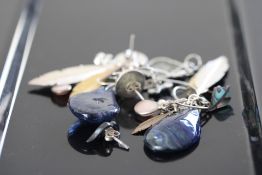 7 pairs of silver earrings