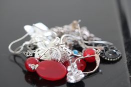 7 Pairs of silver earrings