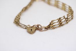 9ct Gold gate bracelet with heart shaped locket We