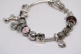 Pandora silver charm bracelet with 14 charms & ori