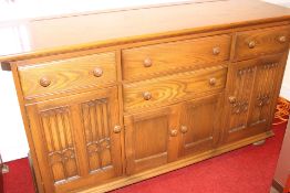 Ercol Mid-20th century oak sideboard with moulded rectangular top over an arrangement of drawers and