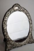 A very decorative early c20th silver framed mirror
