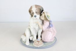 Lladro porcelain group of a seated St Bernard beside a kneeling girl in bonnet and pink dress with