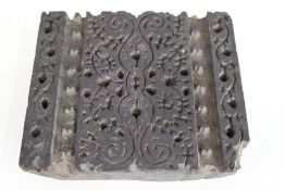 An antique Indian woodblock printing block with de