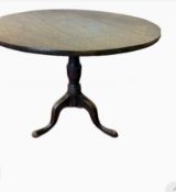 George III oak table, circular top on three splaye