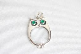An early c21st owl pendant, in the form of a magni