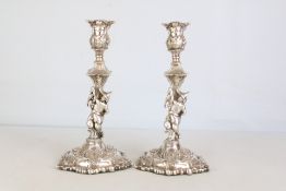Pair of silver candle sticks (ornate figurine) Bir