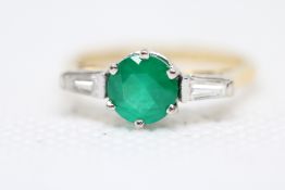 18ct Gold ring set with 2 baguette diamonds & cent