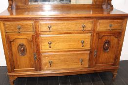 Victorian oak mirror-back sideboard, the moulded cornice supported by turned columns, above a
