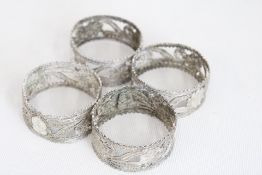 Set of four 19th century white metal filigree napk