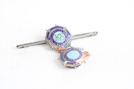A silver and enamelled sweetheart brooch with a bu