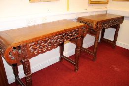 A pair of Chinese hardwood altar tables, each with rectangular top and rounded ends, the apron