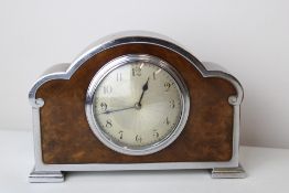 An Art Deco mantle clock. Finished in chrome and f