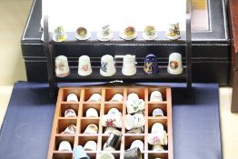 Collection of ceramic thimbles with display stands