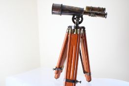 Brass telescope on wooden stand