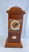 Oak longcase-form mantel clock with brass dial