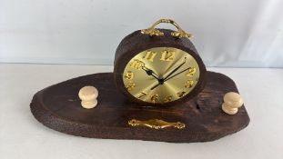 Rustic log-form mantel clock on plank base