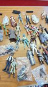 A group of Star Wars action figures and accessories