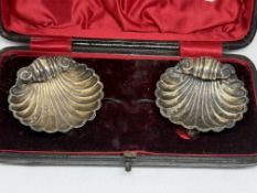 Pair of silver shell salt dishes in plush fitted c