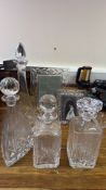 A group of cut-crystal decanters and 2 crystal photograph frames - 1 Royal Doulton & 1 RCR