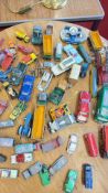 A group of vintage die-cast and tinplate toy vehicles