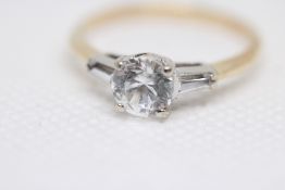 Yellow metal ring set with solitaire cz, set in wh