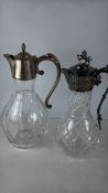 2 Cut-Glass Claret Jugs with White-Metal Mounts