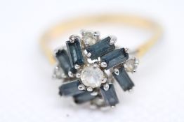 Yellow & white metal ring set with sapphire & whit