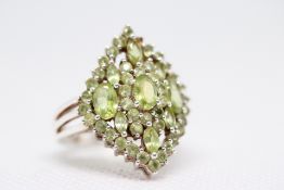 White gold ring set with green tourmaline & diamon