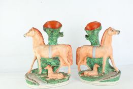 A Pair of Horse and Foal Ceramic Spill Vases - repair to 1 leg