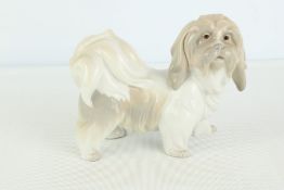 A Lladró porcelain model of a toy dog
