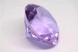 Large amethyst coloured glass paperweight