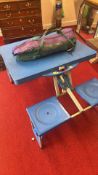 Folding picnic table with integrated seats and carry bag