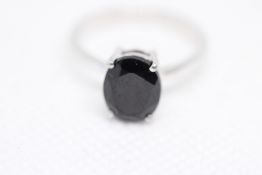 Sterling silver ring set with black spinal gem sto