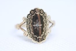 9ct Gold ring set with small central diamond Weigh