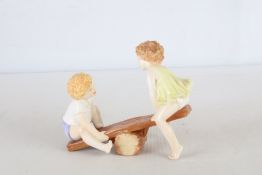 Royal Worcester bone china figure group, “See-Saw”, by Glenis Devereux