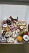 A group of decorative trinket boxes, including porcelain and enamelled examples