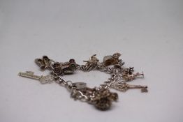 Silver charm bracelet Weight 44.6g