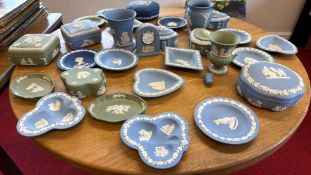 Wedgwood blue and green jasperware group with trinket boxes, dishes and clock
