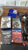 Group of Sony PlayStation PS4 & PSP console, games, controllers and cables