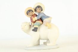 A Lladro porcelain figure of Inuit children riding a polar bear