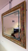 Floral decorated gilt-framed wall mirror