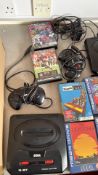 Sega Mega Drive II console with controllers, leads and assorted boxed games
