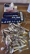 A quantity of flatware with boxed Royal Worcester and Aynsley table accessories