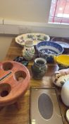 A quantity of decorative ceramics and objects, including blue-and-white bowls, vases, metal birds,