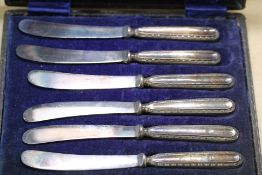 Set of 6 silver butter knives in plush fitted case